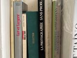 many books that are on a shelf in the room