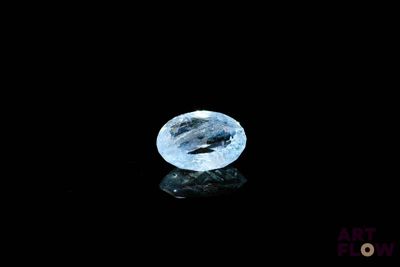 an image of a blue diamond on a black surface