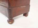 a wooden dresser with a drawer on top of it