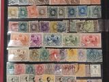 a picture of a collection of stamps in a display case