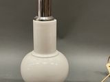 an image of a white table lamp with a metal base and a white lamp shade