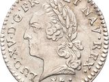 a close up of a coin with a woman ' s head on it