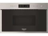 a close up of a stainless steel microwave oven with the door open