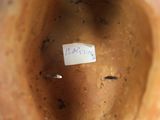 a close up of a vase with a label on it
