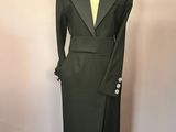 black long sleeved dress with a slited skirt and a lapel collar