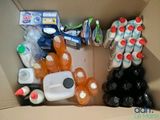 a cardboard box filled with many different types of beverages