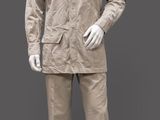 mannequin dressed in khaki suit and hat on a gray background