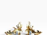 pair of gold plated figurines of two birds on a branch
