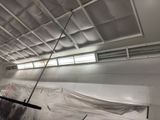 a picture of a room that is being painted with white paint
