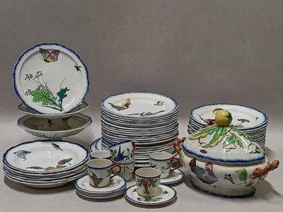 a lot of plates and bowls with birds on them