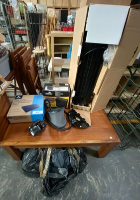 a table with a bunch of items on it in a room