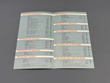 an open book with a list of items on it sitting on a table