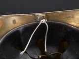 a close up of a hat with a rope hanging from it