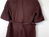 a picture of a brown jacket hanging on a white wall