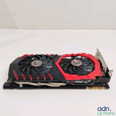 a close up of a red and black graphics card on a white surface