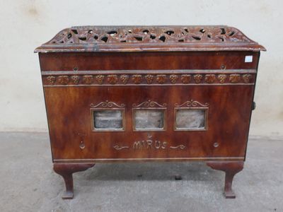 a small wooden box with two glass doors on it