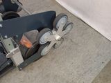 two wheels that are sitting on the floor next to a bed