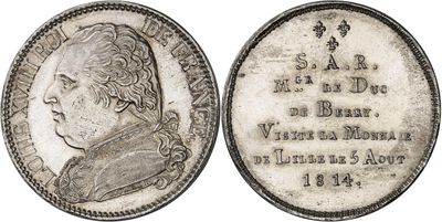 une pièce en argent portant le portrait d'un homme