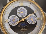an image of a close up of a wrist watch on a table