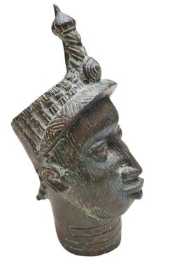 an image of a statue of a man with a bird on top of his head