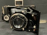 an old camera that is sitting on a table