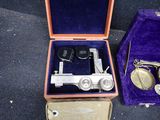 a box with a pair of keys in it and a pair of scissors in it