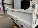 a white truck that is parked in a parking lot