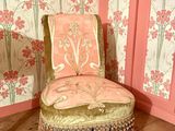 a chair that is sitting in the corner of a room
