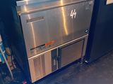 a stainless steel counter top with a dishwasher on it