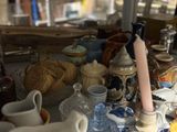 a table with a lot of pottery on it