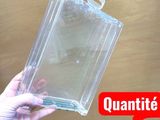 a person holding a clear plastic box with a handle