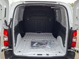 the back of a white van with its cargo door open