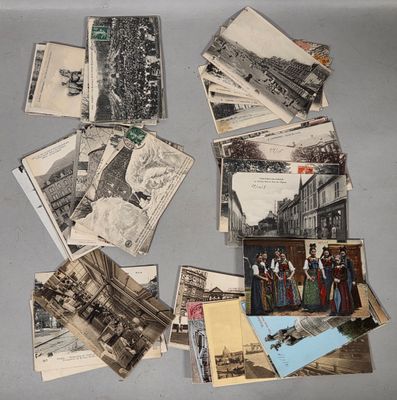 many old photos of people and buildings on the table
