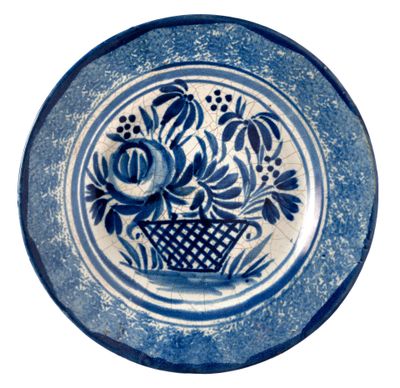 a blue and white plate with flowers on it