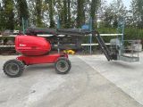 a red scissor parked in a parking lot