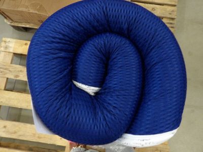 a blue rope wrapped around a blue pillow on a wooden pallet