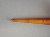 an image of a pipe with a wooden handle