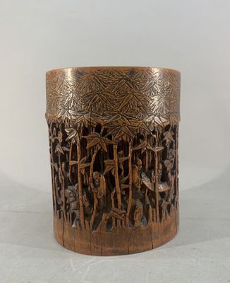an image of a close up of a wooden vase with carvings on it