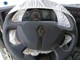 a car dashboard with a steering wheel covered with a white cloth