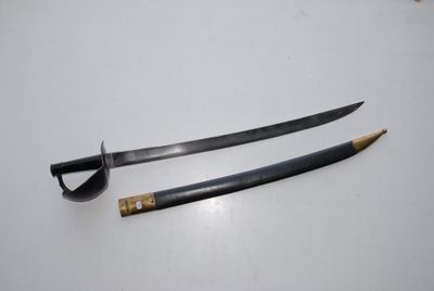 two swords on a white surface with a wooden handle
