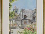 framed watercolor painting of a country house with a bench in the foreground