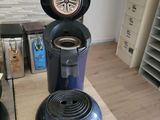 a coffee maker sitting on a counter in a kitchen