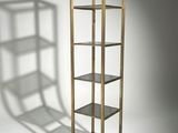 a close up of a book shelf with a shadow on the wall