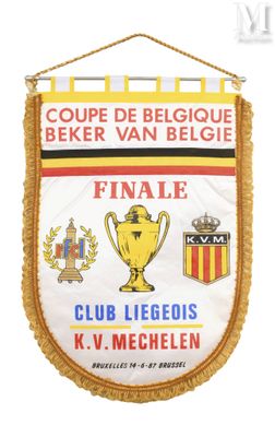 a close up of a banner hanging on a wall