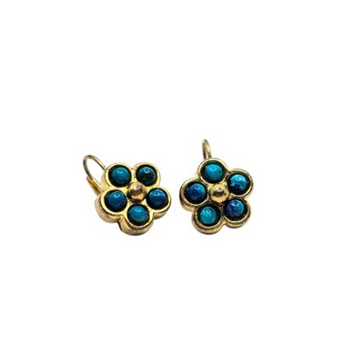 a pair of turquoise and gold earrings on a white background