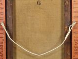 an old wooden frame with a rope hanging from it ' s side