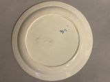 a white plate with a blue design on it