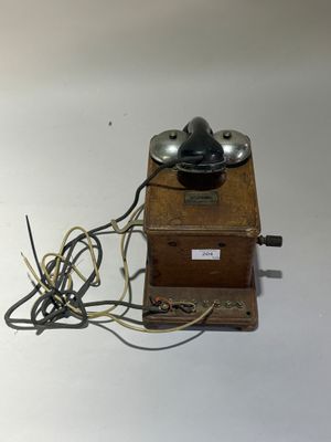 a small wooden box with a lamp on top of it