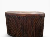 an oval wooden coffee table with a wooden top on a white background