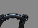 a close up of a chair with a black seat and back